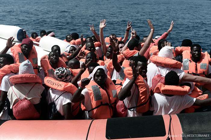 Aquarius is currently in the process of transferring 400 persons to two Italian Navy ships, at the request of the Italian MRCC. Aquarius was instructed by Maritime Rescue Coordination Centre in Rome to sail to Valencia to disembark the remaining 229 people.
 
While this appears to be a quick fix to the current political standoff, this should not set a precedent for future disembarkations. Rescued people should be disembarked in the nearest safe port available.